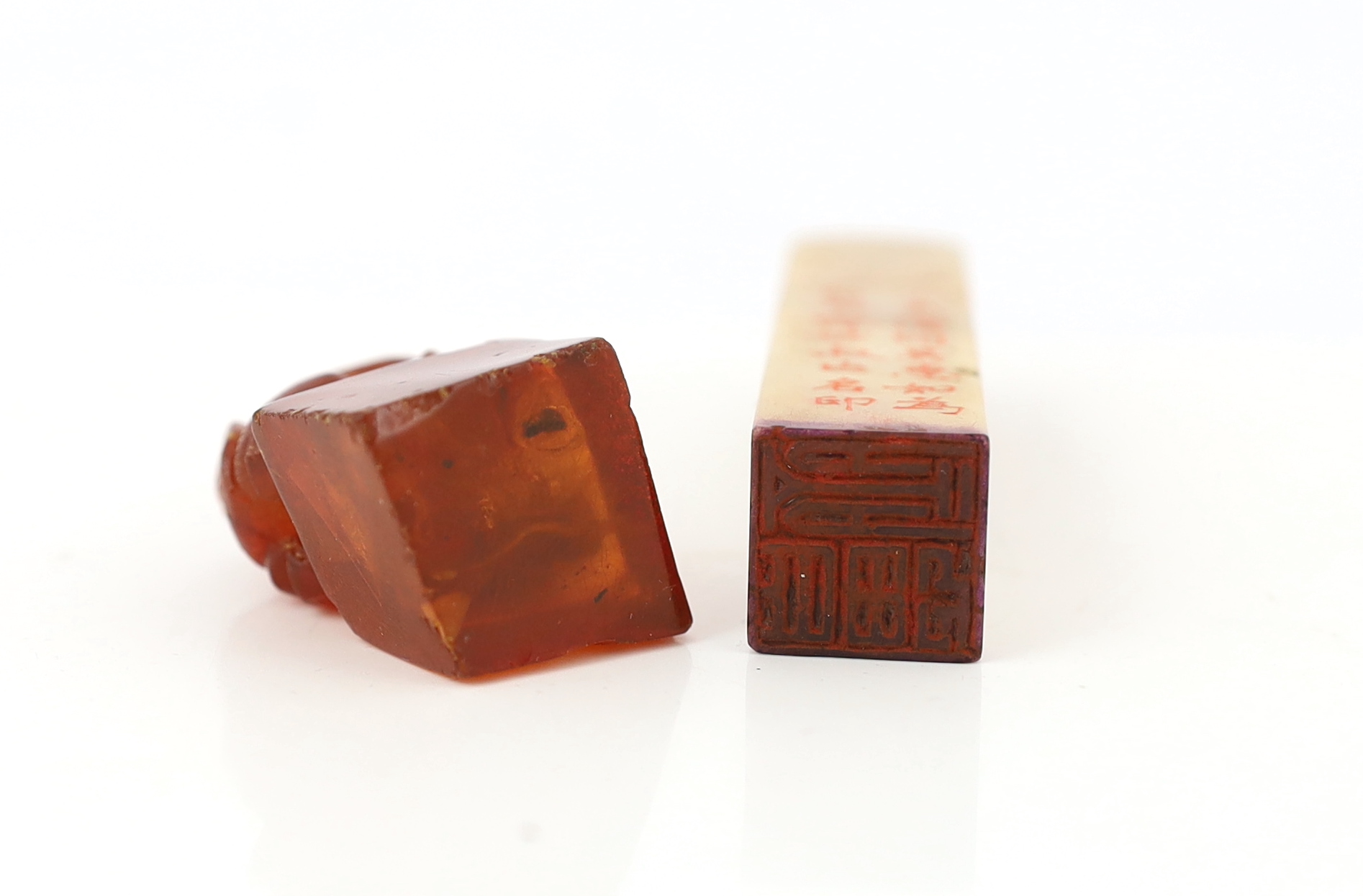 A 19th century Chinese amber ‘lion-dog’ seal and a 20th century soapstone seal